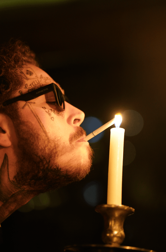 Post Malone, Lighting a Cigarette with Candle - Morrison Hotel Gallery